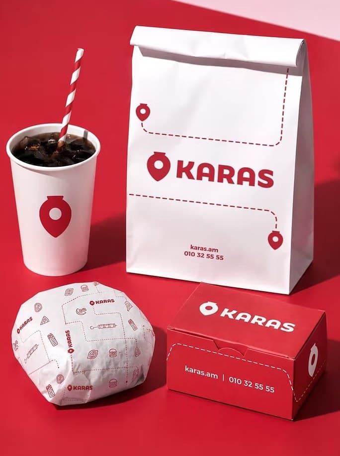 Karas takeaway cup, bag and boxes on a red background