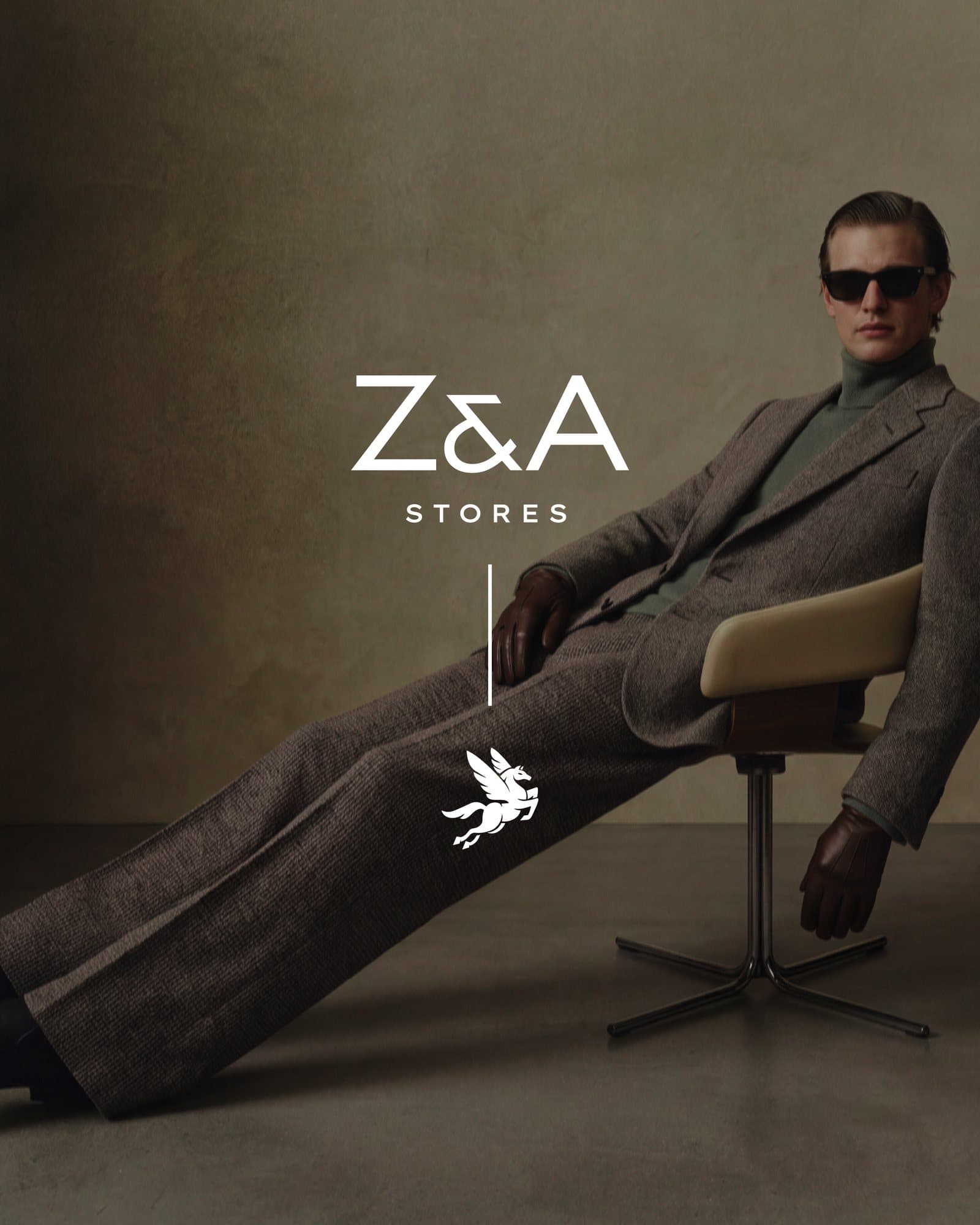 Z&A Stores wordmark and gold Pegasus emblem over a model in a grey suit